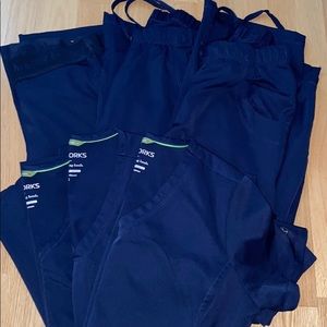 Multiple (3 sets) of navy Healing Hands scrubs.